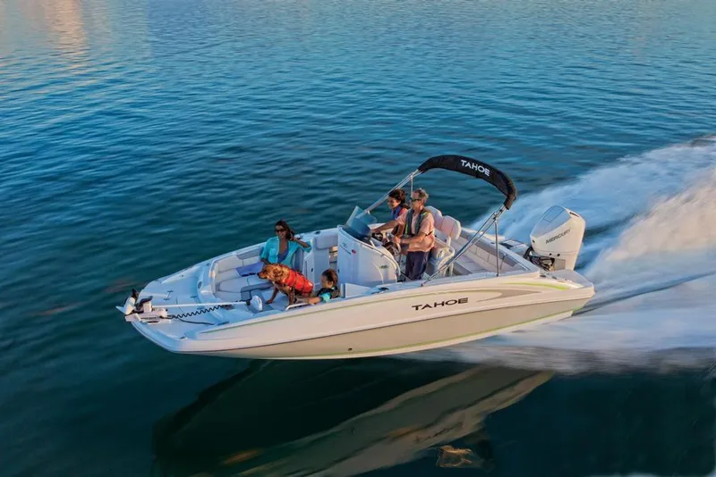 Slide: The Image of 2020 Tahoe 2150 CC boat cruising on calm water with passengers onboard. - 8