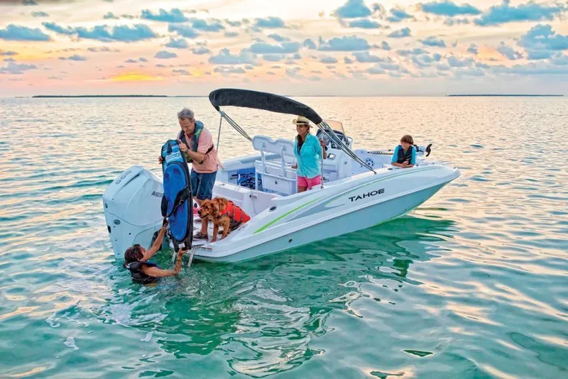 Slide: The Image of Family enjoying a day on a 2020 Tahoe 2150 CC boat at sunset. - 9