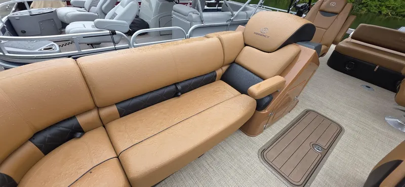 Slide: The Image of Luxurious seating on 2024 Regency 230 LE3 Sport boat with tan upholstery and sleek design. - 6