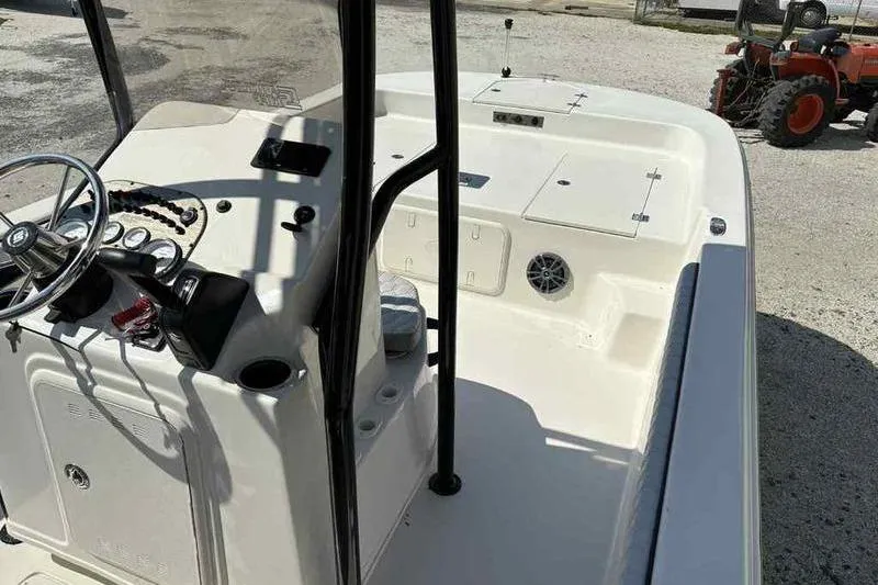 Slide: The Image of 2026 Carolina Skiff 21 LS boat interior with steering console and storage compartments. - 10