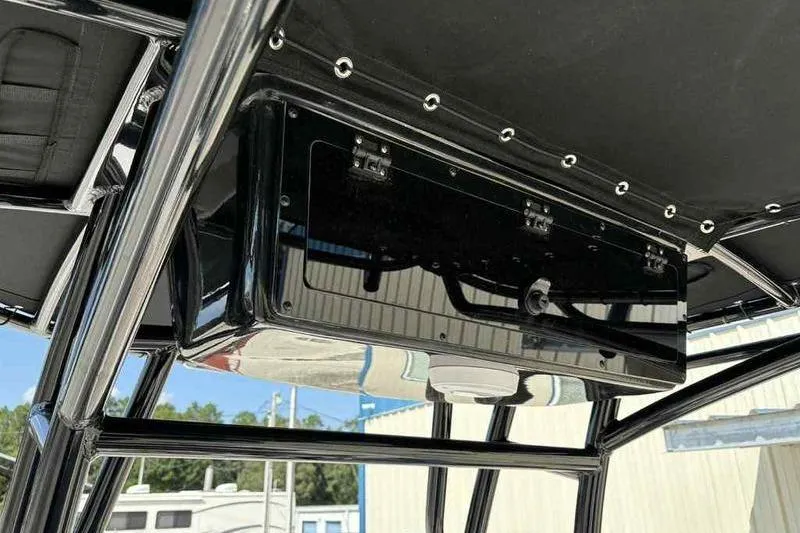 Slide: The Image of 2026 Carolina Skiff 21 LS T-top with black storage box and sturdy frame. - 15
