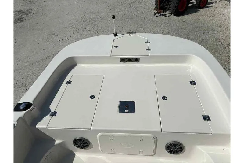 Slide: The Image of 2026 Carolina Skiff 21 LS boat deck with storage compartments and speakers. - 18