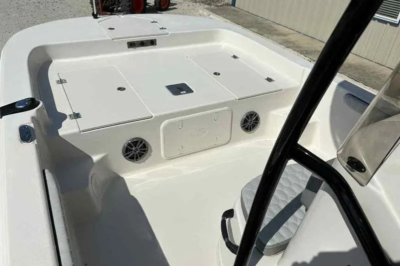 Slide: The Image of 2026 Carolina Skiff 21 LS boat interior with storage compartments and seating. - 19