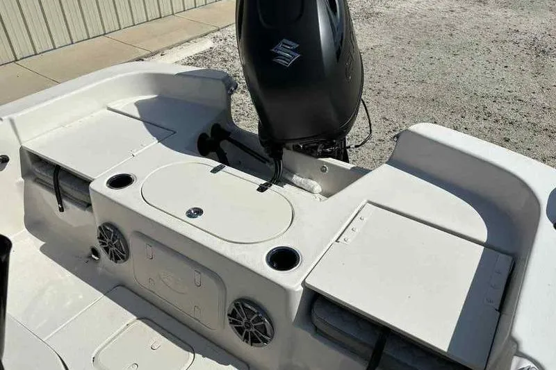 Slide: The Image of 2026 Carolina Skiff 21 LS boat interior with motor and storage compartments. - 21