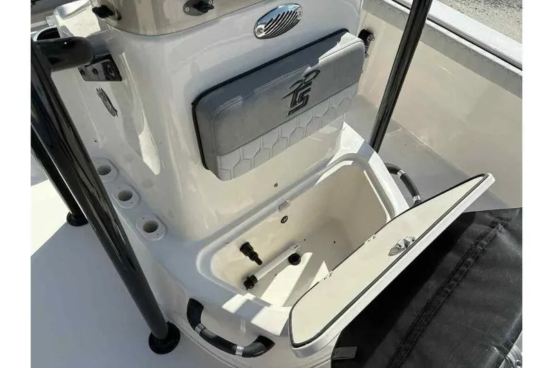 Slide: The Image of 2026 Carolina Skiff 21 LS boat console with storage compartment open. - 22