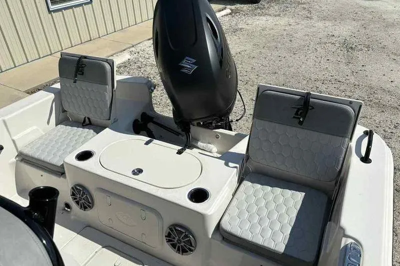 Slide: The Image of 2026 Carolina Skiff 21 LS boat interior with seating and motor, showcasing modern design. - 24