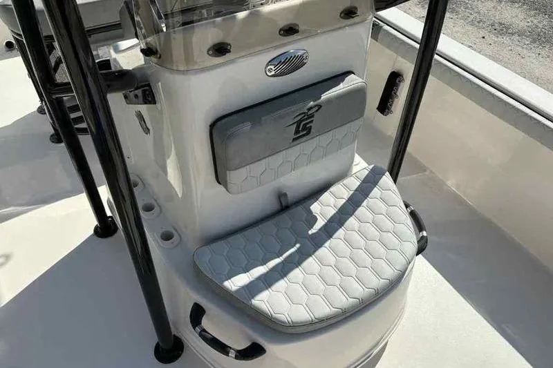 Slide: The Image of 2026 Carolina Skiff 21 LS boat interior with cushioned seating and console. - 25