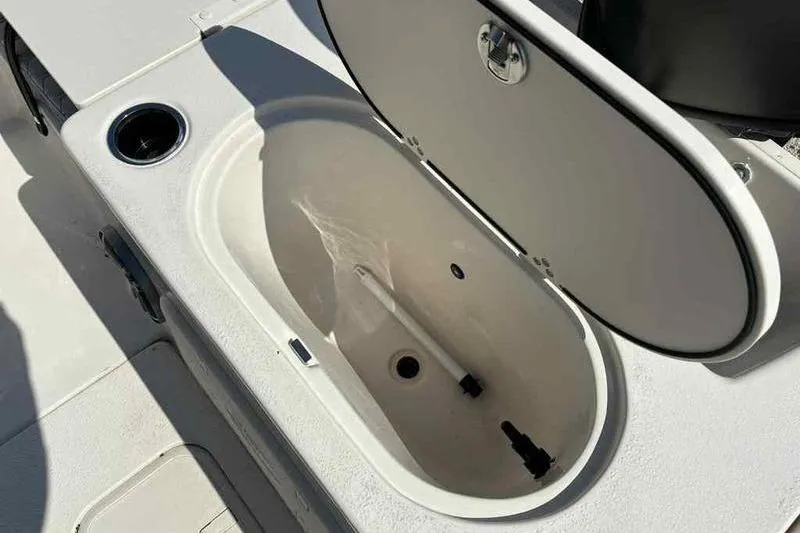 Slide: The Image of Open storage compartment on 2026 Carolina Skiff 21 LS boat. - 9
