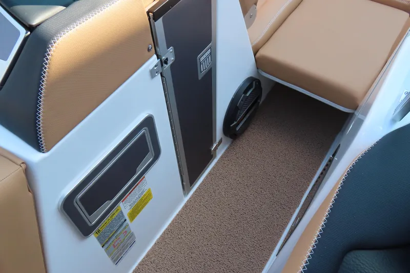 Slide: The Image of 2019 MasterCraft X22 interior with tan seating and carpeted flooring. - 14