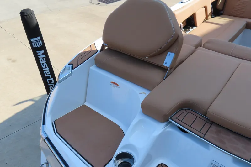 Slide: The Image of 2019 MasterCraft X22 boat with tan seating and sleek design. - 8