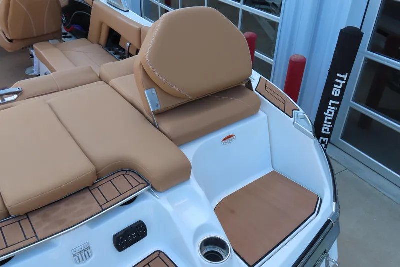 Slide: The Image of 2019 MasterCraft X22 boat interior with tan seating and modern design elements. - 9