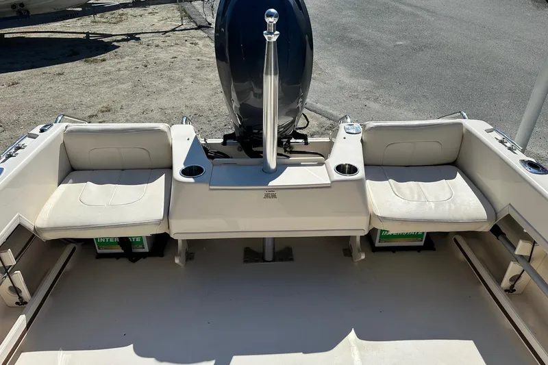 Slide: The Image of 2015 Grady-White Freedom 192 boat interior with seating and engine view. - 10