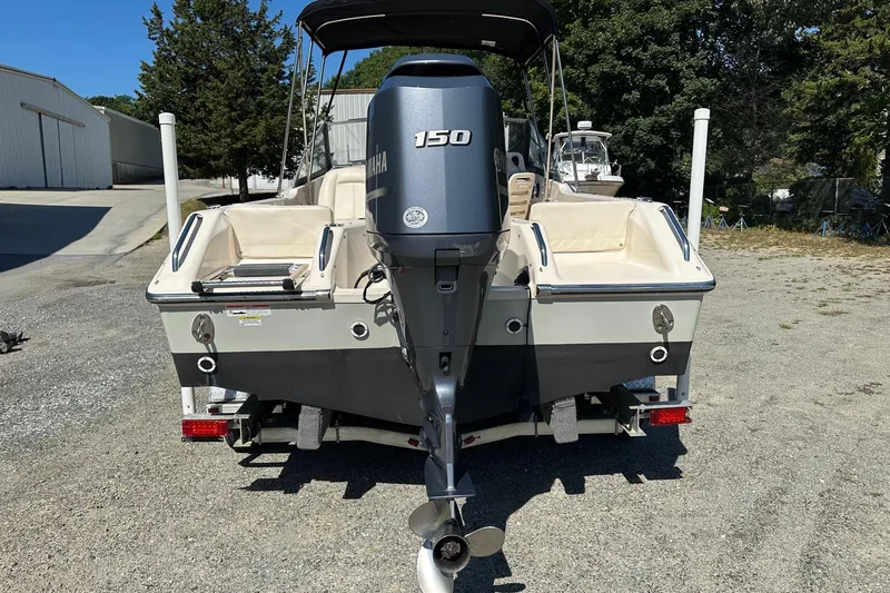 Slide: The Image of 2015 Grady-White Freedom 192 boat with Yamaha 150 engine, parked outdoors. - 11