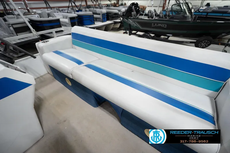 Slide: The Image of 1996 Godfrey Sweetwater 180 EX pontoon boat interior with open storage compartment. - 25