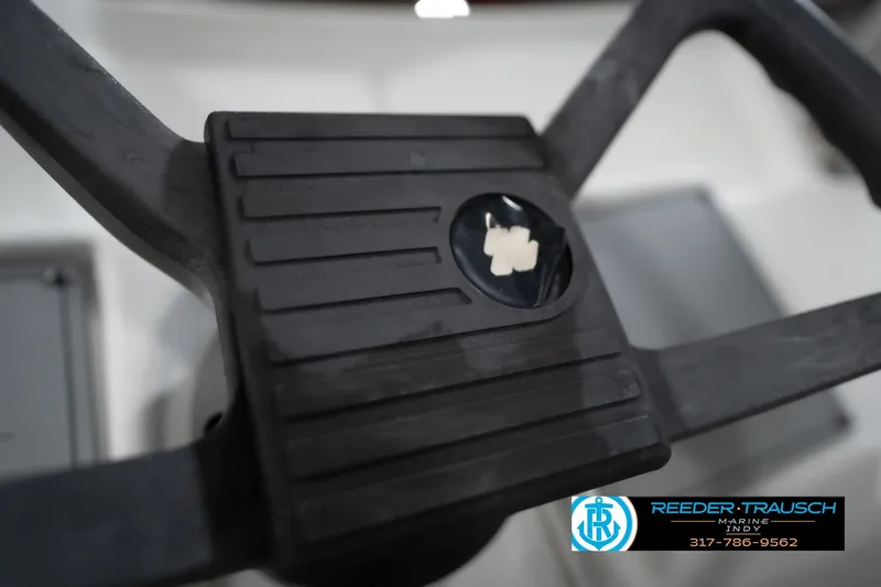 Slide: The Image of 1996 Godfrey Sweetwater 180 EX boat interior with steering wheel and seating. - 29