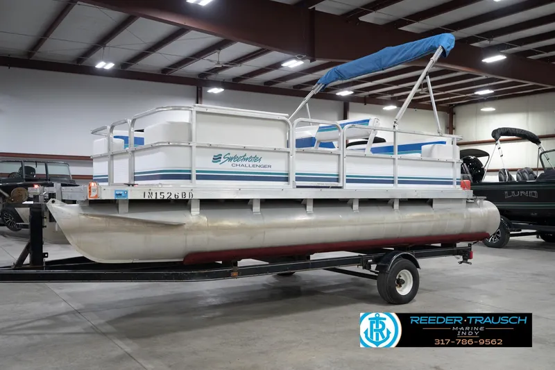 The Image of 1996 Godfrey Sweetwater 180 EX pontoon boat in showroom, side view. - 3
