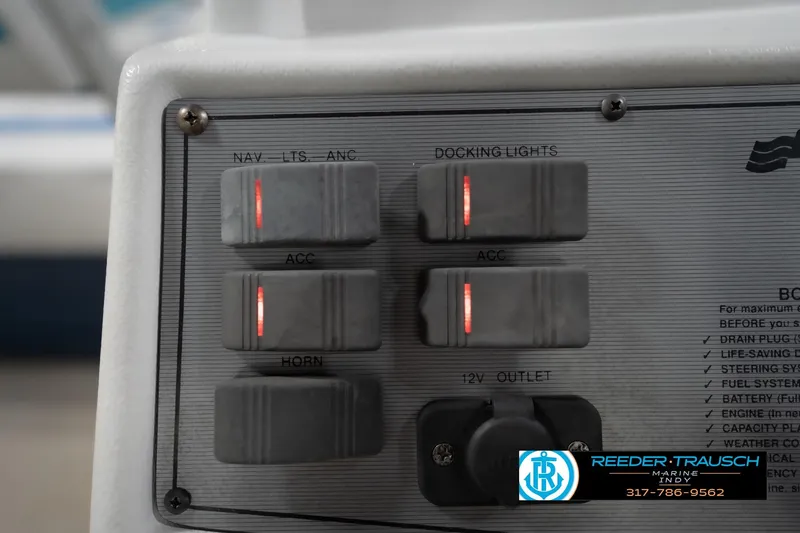 Slide: The Image of 1996 Godfrey Sweetwater 180 EX boat steering console in showroom. - 30