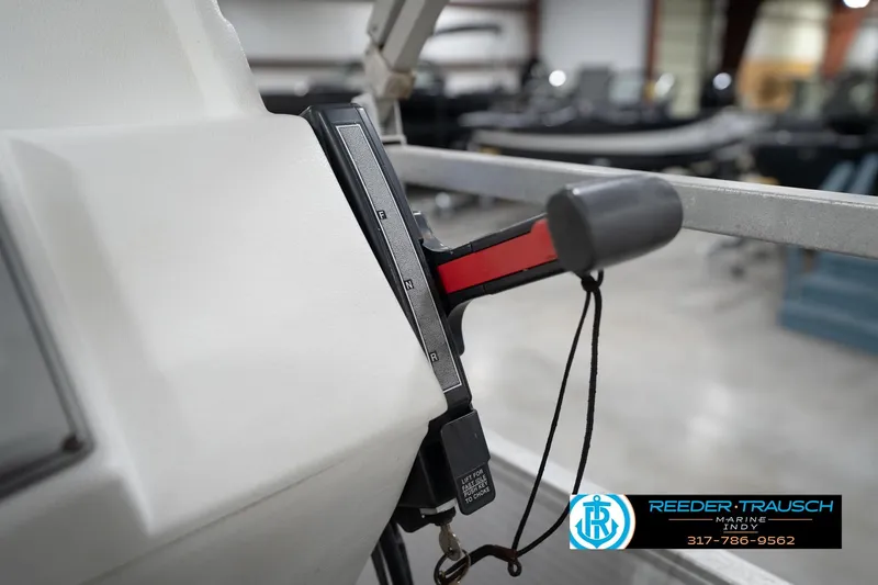 Slide: The Image of Close-up of a 1996 Godfrey Sweetwater 180 EX steering wheel with Reeder-Trausch Marine logo. - 31