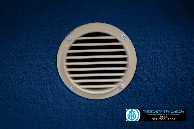 Slide: The Image of 1996 Godfrey Sweetwater 180 EX boat seat with blue and teal stripes, Reeder-Trausch Marine logo. - 36