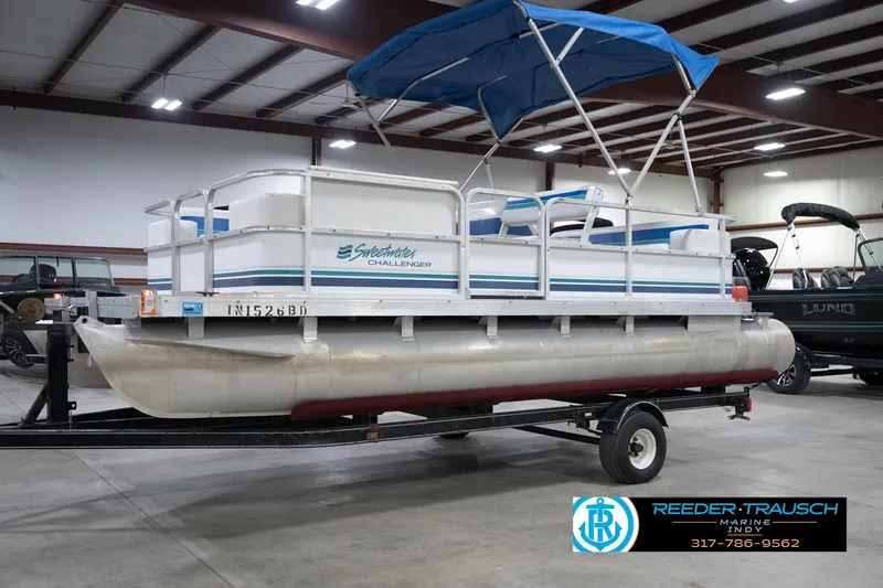 Slide: The Image of 1996 Godfrey Sweetwater 180 EX pontoon boat on trailer in indoor showroom. - 4