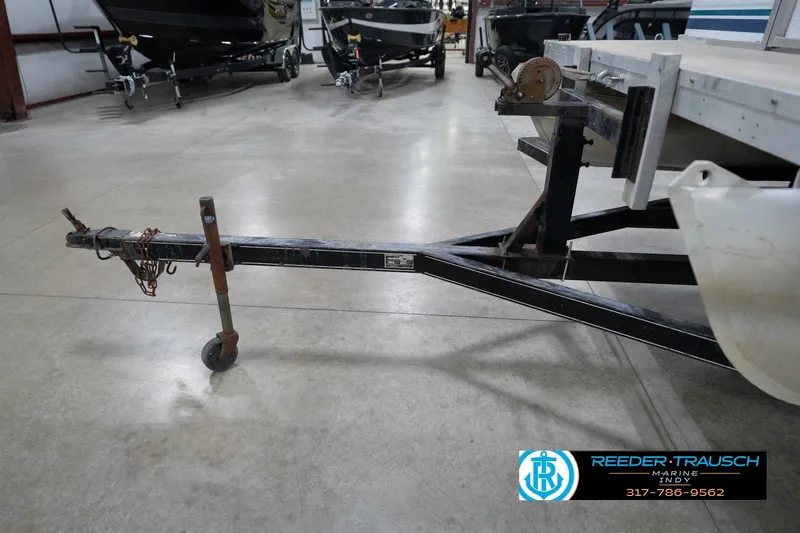 Slide: The Image of Close-up of a 1996 Godfrey Sweetwater 180 EX boat propeller in a garage setting. - 42