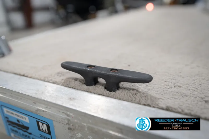 Slide: The Image of Trailer hitch of a 1996 Godfrey Sweetwater 180 EX boat in a showroom. - 44