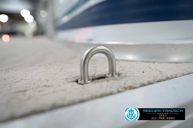 Slide: The Image of Covered 1996 Godfrey Sweetwater 180 EX pontoon boat on trailer in indoor storage. - 45