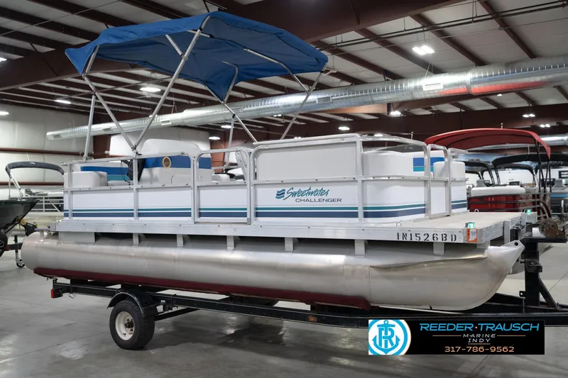 Slide: The Image of 1996 Godfrey Sweetwater 180 EX pontoon boat in indoor storage facility. - 6