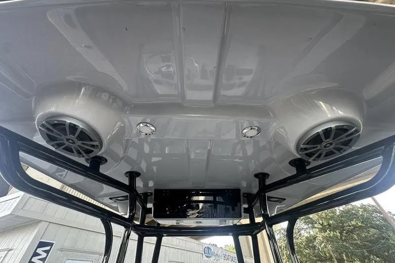 Slide: The Image of 2026 Carolina Skiff 24 Ultra Elite boat roof with speakers and lights. - 14