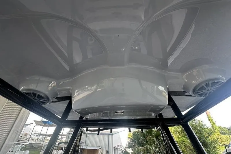 Slide: The Image of 2026 Carolina Skiff 24 Ultra Elite boat interior with speakers and sleek design. - 20