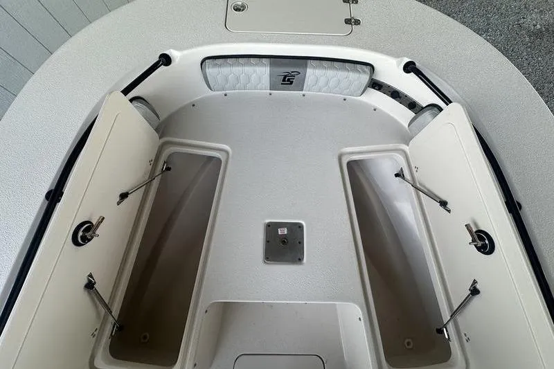 Slide: The Image of 2026 Carolina Skiff 24 Ultra Elite boat interior with open storage compartments. - 23