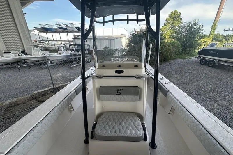 Slide: The Image of 2026 Carolina Skiff 24 Ultra Elite boat interior with seating and console. - 6