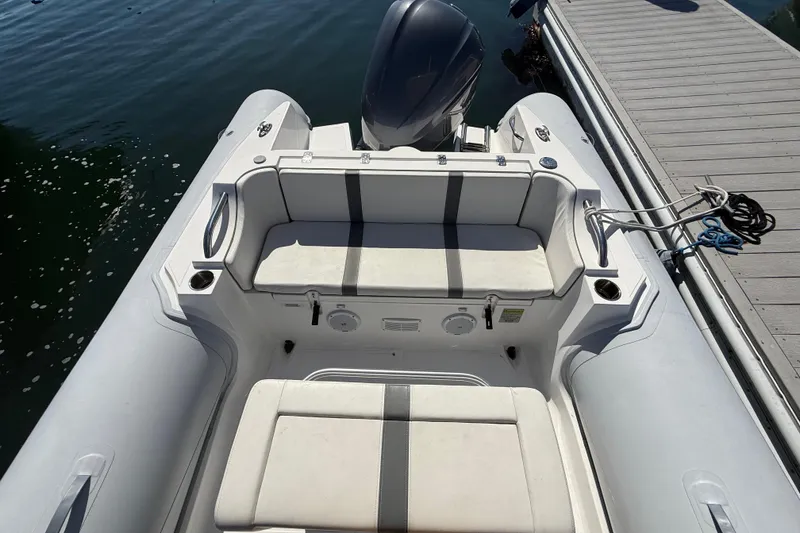 Slide: The Image of 2020 AB Inflatables Oceanus 21 VST boat docked, featuring spacious seating and sleek design. - 11