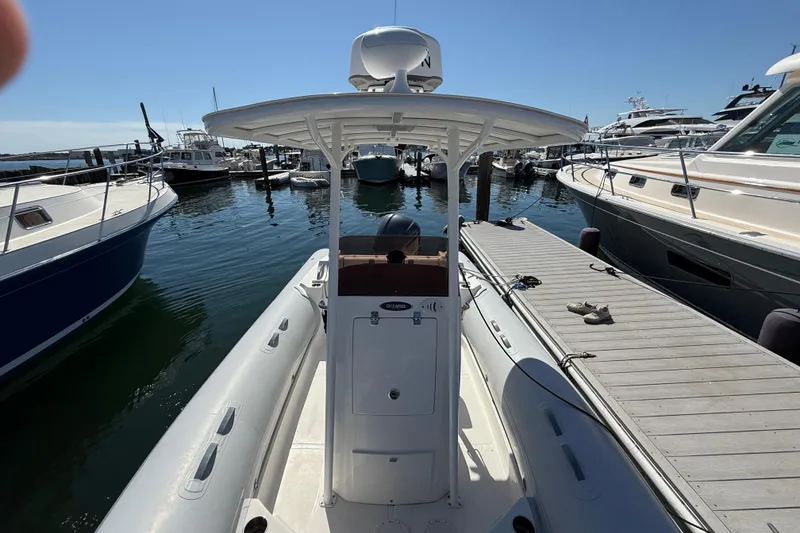 Slide: The Image of 2020 AB Inflatables Oceanus 21 VST docked at marina, surrounded by boats. - 20