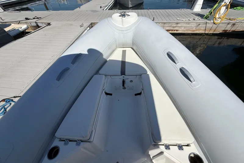 Slide: The Image of 2020 AB Inflatables Oceanus 21 VST boat docked, showcasing seating and deck layout. - 16