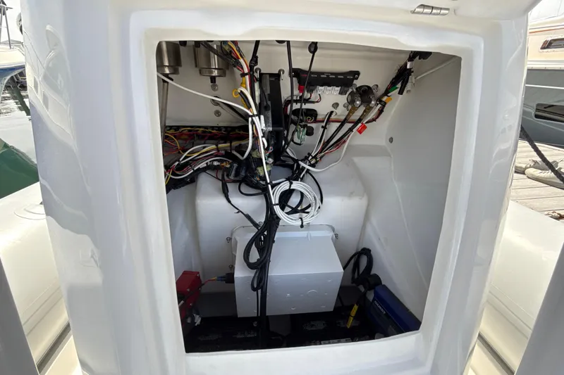 Slide: The Image of Electrical compartment of 2020 AB Inflatables Oceanus 21 VST boat, showing wiring and components. - 21