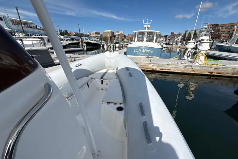 Slide: The Image of 2020 AB Inflatables Oceanus 21 VST docked at a marina under clear blue skies. - 14