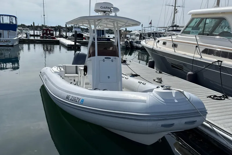 The Image of 2020 AB Inflatables Oceanus 21 VST boat docked at marina, featuring sleek design and modern equipment. - 0