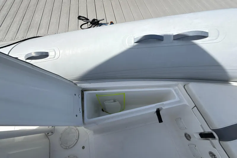 Slide: The Image of 2020 AB Inflatables Oceanus 21 VST boat storage compartment open on deck. - 19