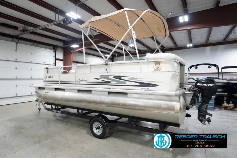 Slide: The Image of 2008 Misty Harbor 2085CR pontoon boat with canopy in indoor storage. - 10