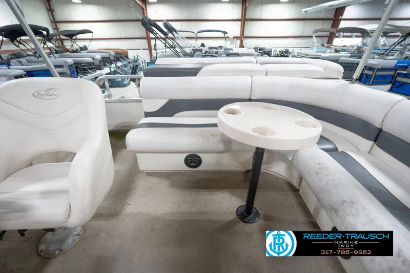 Slide: The Image of 2008 Misty Harbor 2085CR pontoon boat interior with seating and cupholder table. - 18