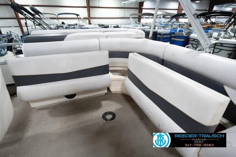 Slide: The Image of 2008 Misty Harbor 2085CR pontoon boat interior with white and gray seating in showroom. - 25