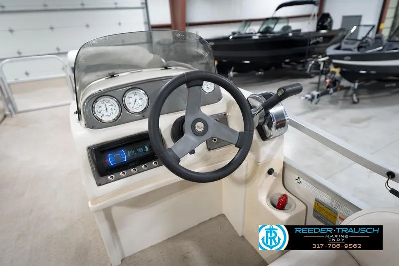 Slide: The Image of Steering console of a 2008 Misty Harbor 2085CR boat in a showroom. - 27