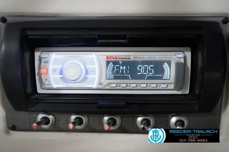 Slide: The Image of 2008 Misty Harbor 2085CR boat stereo system with FM display and control switches. - 29