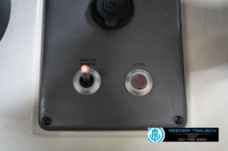Slide: The Image of Control panel of a 2008 Misty Harbor 2085CR boat with master power and horn buttons. - 32