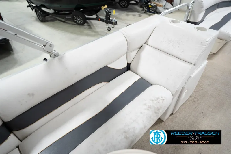 Slide: The Image of 2008 Misty Harbor 2085CR boat interior with white and gray seating, cup holders visible. - 37