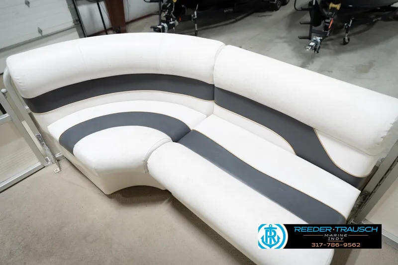 Slide: The Image of White and gray seating on a 2008 Misty Harbor 2085CR boat, indoor showroom. - 38