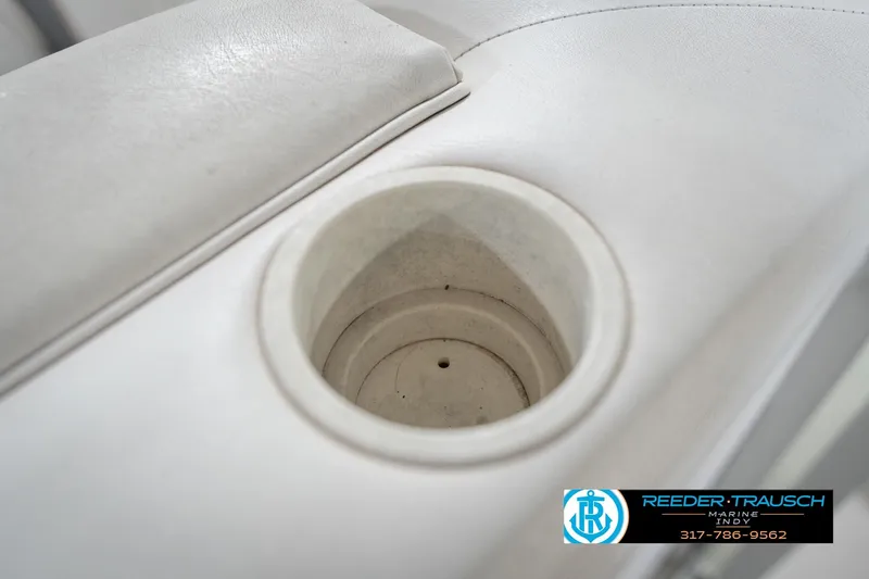 Slide: The Image of Close-up of a 2008 Misty Harbor 2085CR boat cup holder with white upholstery. - 40
