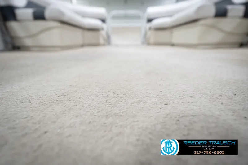 Slide: The Image of 2008 Misty Harbor 2085CR boat interior with beige carpet and seating. - 41