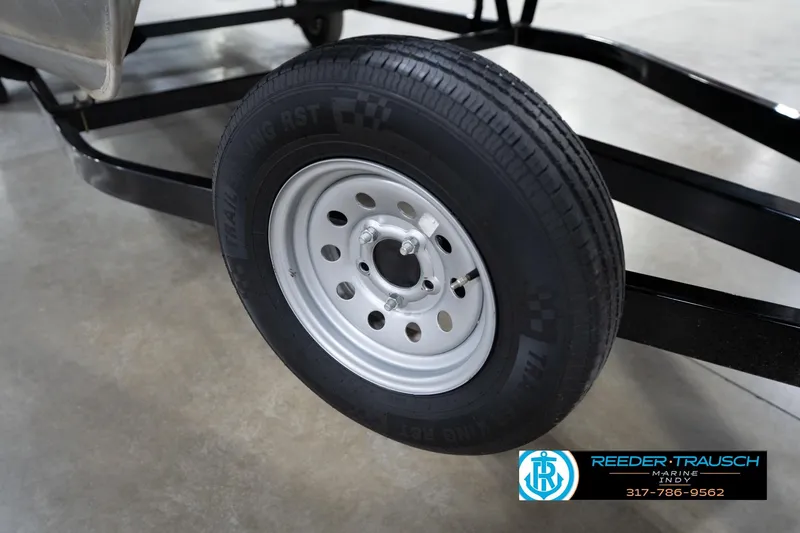 Slide: The Image of Trailer wheel of a 2008 Misty Harbor 2085CR boat, displayed indoors. - 50